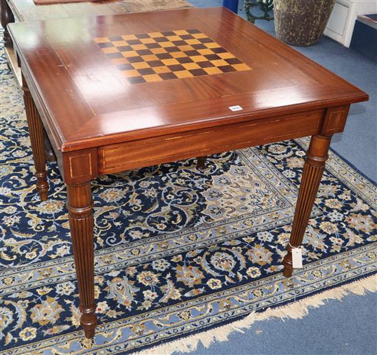 A George III style inlaid mahogany games table for backgammon, with draughts and chessmen